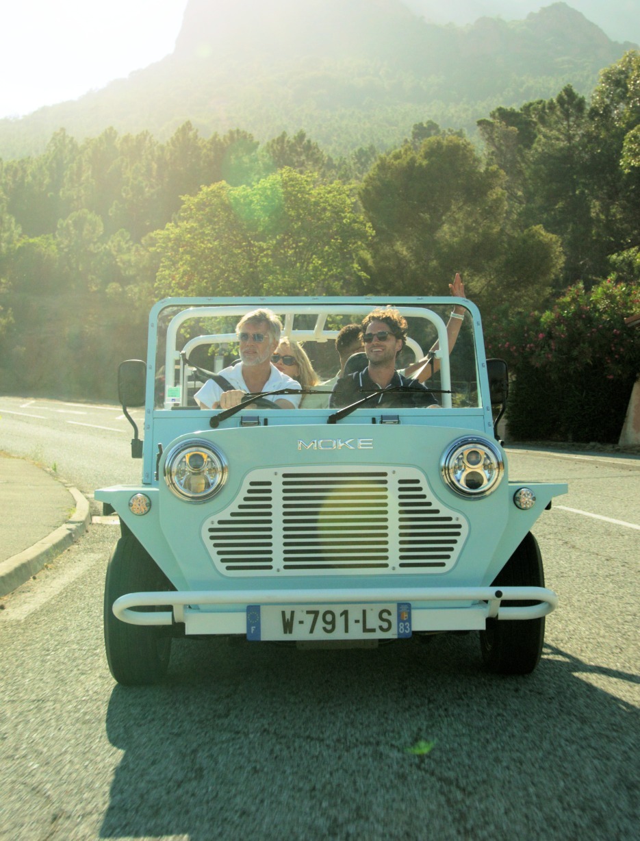 A small group of people smiling and enjoying a scenic drive through villages and mountainous regions in Sotogrande, Spain