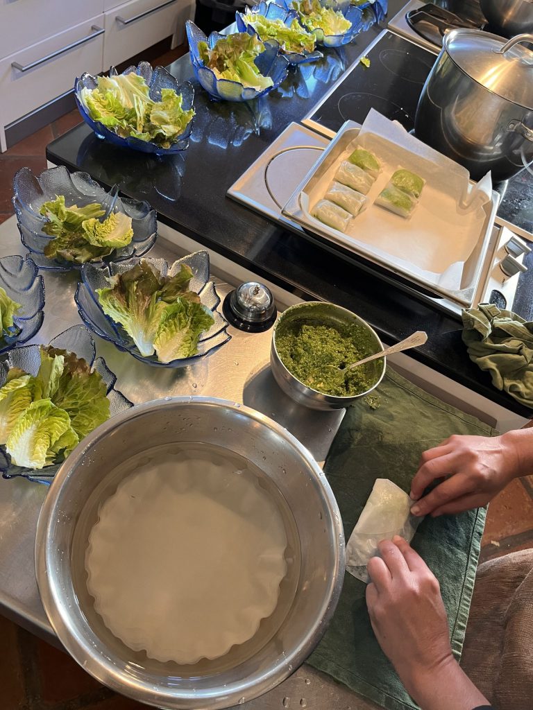 Person preparing appetizers at a villa for Eco Gloria's Sustainable Moke Experience.